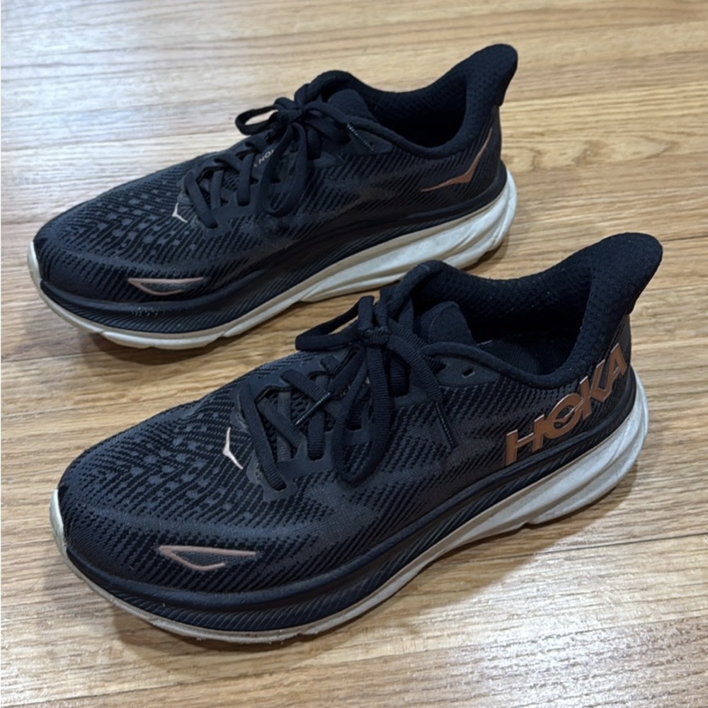 HOKA Clifton 9 Black and Rose Gold Tennis Shoes